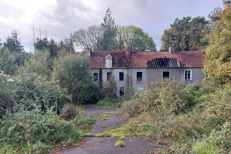 Fire-damaged abandoned house exterior